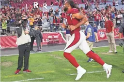 ?? MICHAEL CHOW/THE REPUBLIC ?? Cardinals wide receiver Larry Fitzgerald (11) runs off the field after beating the Browns at State Farm Stadium.