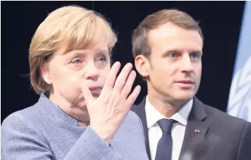  ??  ?? German Chancellor Angela Merkel (left) gestures next to France’s President Emmanuel Macron as they attend the 23rd Conference of the Parties climate talks in Bonn, Germany, yesterday. World leaders arrive at the global climate talks in Germany on...