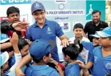  ?? — PTI ?? Sourav Ganguly interacts with kids.