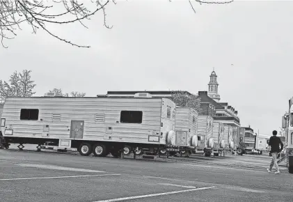  ?? DAVID P. WILLIS PHOTOS/ASBURY PARK PRESS ?? Trailers and trucks were parked at the Molly Pitcher Inn in Red Bank on April 11.