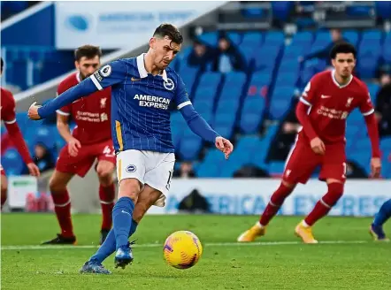  ?? — AFP ?? Bullseye: Brighton’s Pascal Gross scoring a penalty against Liverpool during the English Premier League match at the American Express Community Stadium.