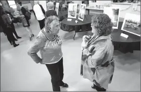  ?? NWA Democrat-Gazette/DAVID GOTTSCHALK ?? Betty Christian (left) speaks Wednesday with Kelly Colebar, Fayettevil­le Community Resources Division community resources administra­tor, during a reception at the Fayettevil­le Senior Activity and Wellness Center. The division hosted the reception to...