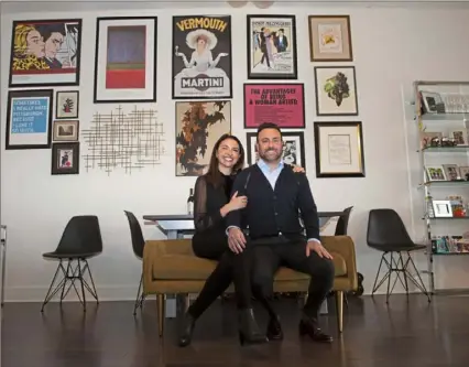  ?? Emily Matthews/Post-Gazette ?? Carolina Vélez and Adam Quatrini in their apartment on Smallman Street in the Strip District.