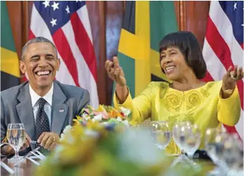  ?? AP PHOTO ?? US PRESIDENT Barack Obama smiles as he reacts to comments made by Jamaican Prime Minister Portia Simpson-Miller, right, during their bilateral meeting at the Jamaica House, Thursday, April 9, 2015, in Kingston, Jamaica.