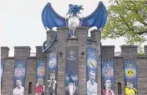  ??  ?? Larger than life: A mural in Whitchurch, where Bale grew up, and his image draped on Cardiff Castle