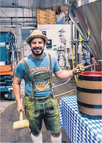  ?? COURTESY OF CORY CAMPBELL ?? La Cumbre Brewing Co. President Jeff Erway enjoys an Oktoberfes­t beer from one of several Bavarian fassers he recently purchased.