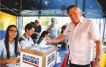  ?? Reuters ?? Leopoldo Lopez Gil, father of Venezuelan opposition leader Leopoldo Lopez, casts his vote during an unofficial plebiscite against Venezuela’s President Nicolas Maduro’s government on Sunday.