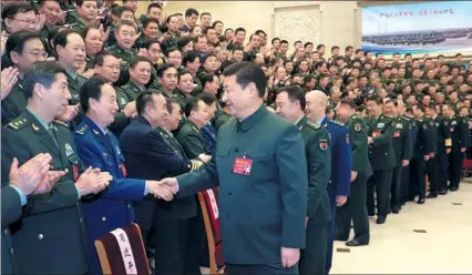  ?? LI GANG / XINHUA ?? Xi Jinping, general secretary of the Communist Party of China Central Committee, meets top-ranking officers on Thursday in his first military gathering since he was re-elected chairman of the CPC Central Military Commission one day earlier.