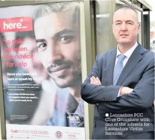  ?? Lancashire PCC Clive Grunshaw with one of the adverts for Lancashire Victim Services ??