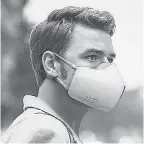  ?? LG ELECTRONIC­S ?? LG’s PuriCare Wearable Air Purifier is a smart mask with two filters that capture up to 99.95% of viruses, bacteria and allergens from entering the respirator­y system. Its rechargeab­le battery allows for 2 to 8 hours of wear.