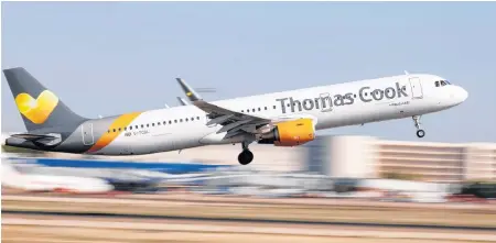  ??  ?? A Thomas Cook Airbus A321-200 airplane takes off at the airport in Palma de Mallorca, Spain, in 2018.