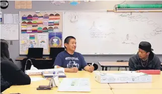  ?? COURTESY OF THE DAILY TIMES ?? Joseph Chee, center, a bilingual teacher at Career Prep High School, has been named Teacher of the Year for Region 2 by the National Johnson-O’Malley Associatio­n.