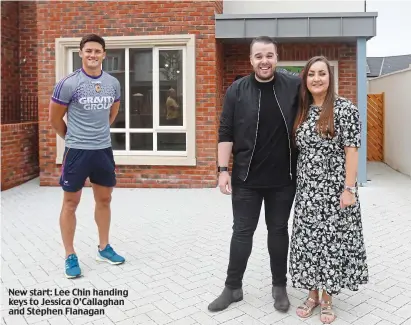  ??  ?? New start: Lee Chin handing keys to Jessica O’Callaghan and Stephen Flanagan