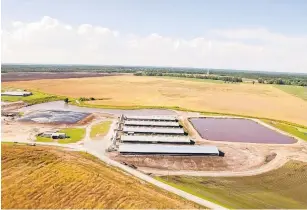  ?? COURTESY OF SMITHFIELD FOODS ?? This Smithfield Foods contract hog farm in N.C. is part of a project to transform manure into renewable energy.
