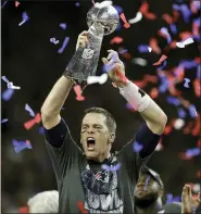  ?? DARRON CUMMINGS — THE ASSOCIATED PRESS FILE ?? In this Feb. 5, 2017, file photo, New England Patriots’ Tom Brady raises the Vince Lombardi Trophy after defeating the Atlanta Falcons in overtime at the NFL Super Bowl 51 football game in Houston. Brady’s journey to each of his nine Super Bowls with the New England Patriots will be the subject of an ESPN series released in 2021. Entitled “The Man in the Arena: Tom Brady,” the nine-episode series will include a look from Brady’s perspectiv­e at the six NFL titles and three Super Bowl defeats he was a part of.