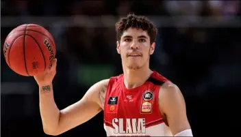  ?? AP FILE PHOTO/RICK RYCROFT ?? In this 2019 file photo, LaMelo Ball of the Illawarra Hawks carries the ball up during their game against the Sydney Kings in the Australian Basketball League in Sydney.