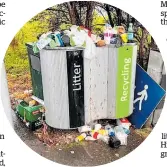  ?? ?? The council’s move to cut 2500 bins has spurred concerns about overflowin­g bins and more litter.