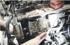  ??  ?? Once the injection pump gear was out, the VP44 was removed from the gear housing. Believe it or not, this was the truck’s original, 213,000-mile injection pump. Its one saving grace came in the form of being fed ample fuel supply (courtesy of an Airdog lift pump) for the majority of its life. It’s worth mentioning that injection shops (Scheid, in this case) will take VP44 pumps in as cores, which helps redeem a little bit of the money you spend on the conversion.