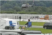  ?? MATT SLOCUM/ASSOCIATED PRESS ?? A medical helicopter takes off from the infield during the IndyCar race Sunday at Pocono Raceway in Long Pond, Pa.