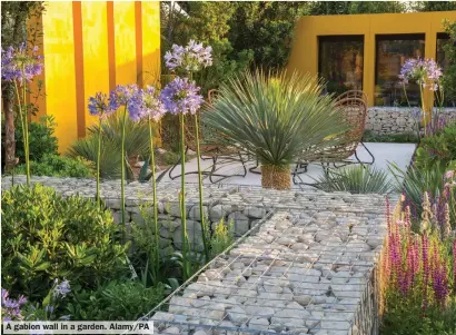  ?? ?? A gabion wall in a garden. Alamy/PA