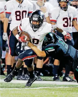  ?? [BY STEVE SISNEY, THE OKLAHOMAN] ?? Tulsa Union’s Patrick Fields, left, intercepts a pass during a 2016 game against Norman North. Fields is one of several early enrollees at Oklahoma.