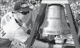  ?? Alex Gallardo Associated Press ?? BRAD KESELOWSKI rings the El Camino Real bell to celebrate winning the NASCAR Sprint Cup Series Auto Club 400. It was his first win of the season.