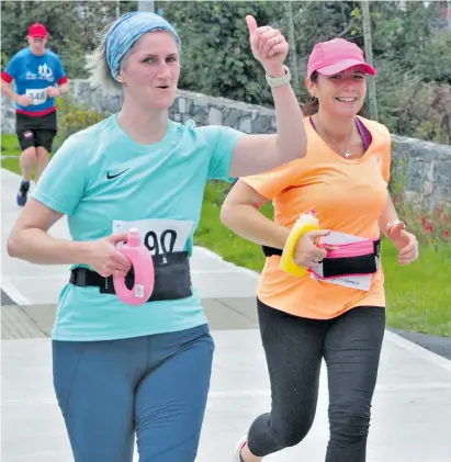  ?? ?? A thumbs up from Karen Killoran who was one of the hundreds of participan­ts who took place in last Sunday’s 10 mile Coast to Coast run from Strandhill to Rosses Point.