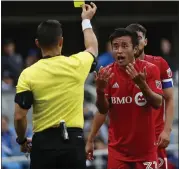  ??  ?? Toronto FC’S Tsubasa Endoh reacts to a yellow card call in extra time after fouling Oswaldo Alanis.