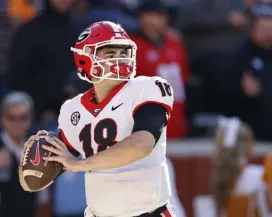  ?? Wade Payne, Associated Press ?? Georgia quarterbac­k JT Daniels throws during warmups Saturday in Knoxville, Tenn.