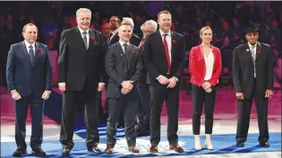  ?? CP PHOTO ?? NHL commission­er Gary Bettman, left, joins Hockey Hall of Fame inductees Alexander Yakushev, Martin St. Louis, Martin Brodeur, Jayna Hefford and Willie O’ree for a ceremony prior to NHL action between the Toronto Maple Leafs and the New Jersey Devils in Toronto on Friday.