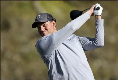  ?? MIKE CARLSON — THE ASSOCIATED PRESS ?? Adam Schenk tees off on the fifth hole during the second round of the Valspar Championsh­ip on Friday at Innisbrook in Palm Harbor, Fla.