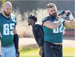  ?? AP ?? Eagles center Jason Kelce, right, and offensive tackle Lane Johnson warm up during a practice for the Super Bowl on Wednesday in Tempe, Ariz.