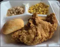  ?? (Arkansas Democrat-Gazette/Eric E. Harrison) ?? Flint’s Just Like Mom’s recently reopened in the Union Plaza Building, Capitol Avenue and Louisiana Street, offering plate lunches — in this case, fried chicken with corn, great northern beans and a choice of roll (pictured) or corn bread.