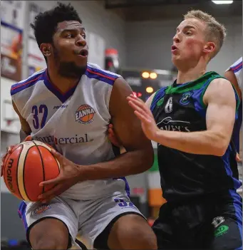  ??  ?? Tamron Manning of Eanna in action against Darragh O’Hanlon of Garvey’s Tralee Warriors during the Basketball Ireland Men’s Superleagu­e match between Garveys Tralee Warriors and Eanna BC at Tralee Sports Complex in Tralee, Kerry. Photo by Brendan...