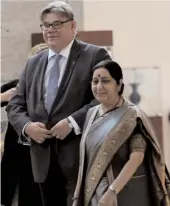  ?? — AFP ?? External affairs minister Sushma Swaraj with Finland’s foreign minister Timo Soini before a meeting in New Delhi on Friday.
