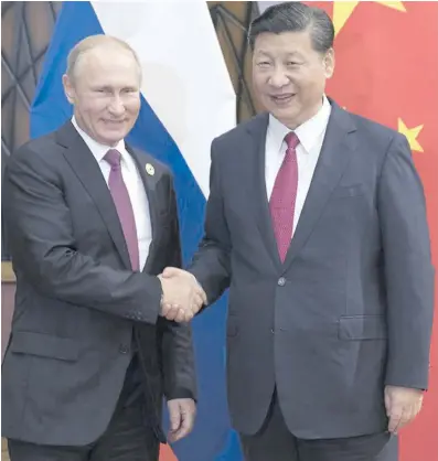  ?? Photo: Xinhua/Lan Hongguang ?? Chinese President Xi Jinping (right) with his Russian counterpar­t Vladimir Putin in Da Nang, Vietnam, on November 10, 2017.