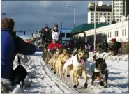  ?? AP PHOTO/RACHEL D’ORO, FILE ?? FILE - Musher Peter Kaiser, of Bethel, Alaska, leads his team past spectators during the ceremonial start of the Iditarod Trail Sled Dog Race, in Anchorage, Alaska, March 7, 2015.