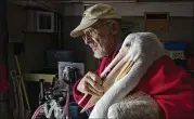  ?? COURTNEY SACCO / CORPUS CHRISTI CALLER-TIMES ?? Volunteer Tom Christians­on carries a white pelican to the bird enclosure at the Amos Rehabilita­tion Keep in Corpus Christi, Texas. Animals were brought back for the first time since Hurricane Harvey struck in late August.