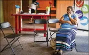  ?? NICK WAGNER / AMERICANST­ATESMAN ?? Nora Reyes speaks to a friend on her phone at the River Valley Christian Fellowship building in Bastrop on July 13. Reyes and three of her children were forced to evacuate their home after an oil spill from a pipe in the 400 block of FM-20.