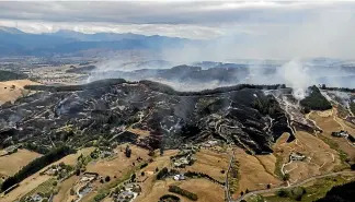  ?? TIM CUFF ?? An aerial photo showing the fire ground from Pigeon Valley to the Redwood Hills in Tasman.