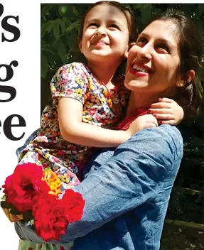  ??  ?? REUNITED FOR NOW: Nazanin hugs her young daughter Gabriella