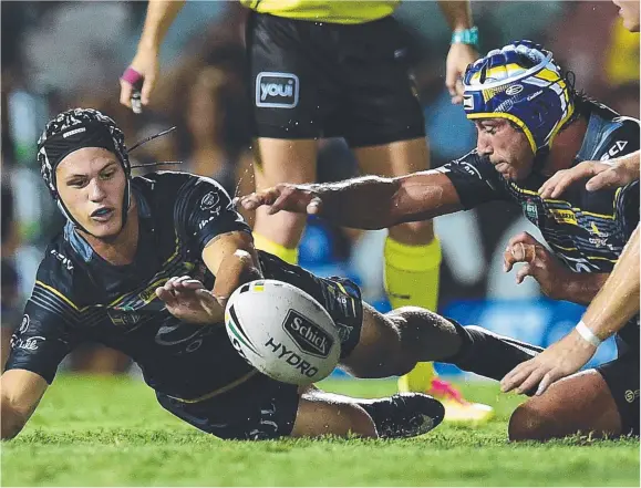  ?? BIG SHIFT: North Queensland Cowboys’ Kalyn Ponga and Johnathan Thurston go after a loose a ball during their loss to the Manly Sea Eagles. Picture: WESLEY MONTS ??