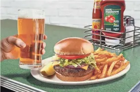  ?? PROVIDED BY METRO DINER ?? Metro Diner’s menu matchups pair a choice of alcoholic beverage with one of the restaurant’s signature entrees. Shown is the classic burger and local beer.