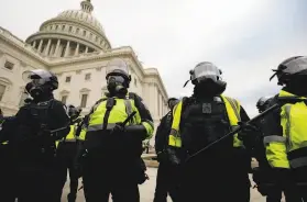  ?? Yuri Gripas / Abaca Press ?? Police during the Jan. 6 riot at the U.S. Capitol. An appeals court ruling in a separate case may be relevant after President Trump’s preinsurre­ction talk.