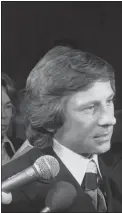  ?? THE ASSOCIATED PRESS ?? Movie director Roman Polanski talks with reporters outside the courtroom where he was arraigned on March 30, 1977, in Los Angeles, on rape and sex perversion charges. The case involving Polanski, who fled the United States after he was accused of forcing himself on a 13-yearold girl during a photo shoot, has spanned 45 years.