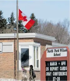  ?? GORD WALDNER/The StarPhoeni­x ?? Saskatoon schools, including North Park Wilson School, flew their Canadian flags at half-mast Wednesday to honour troops who died during Canada’s mission in Afghanista­n, which ended Wednesday.