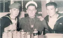  ??  ?? Victor Flett, right, with fellow servicemen in the navy.