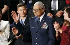  ?? PATRICK SEMANSKY — THE ASSOCIATED PRESS FILE ?? Tuskegee airman Charles McGee and his great grandson Iain Lanphier react as President Donald Trump delivers his State of the Union address to a joint session of Congress on Capitol Hill in Washington, Feb. 4, 2020. McGee, one of the last surviving Tuskegee Airmen who flew 409fighter combat missions over three wars, died Sunday.