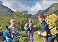  ??  ?? A smiling Corinna Goeckeritz leads another Arran Ranger Service walk into the hills.