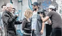  ?? Gordon Timpen Sony Pictures ?? ACTOR Stephen Lang creeps up on Jane Levy, monitored by director Fede Alvarez and followed by Pedro Luque’s camera lens.